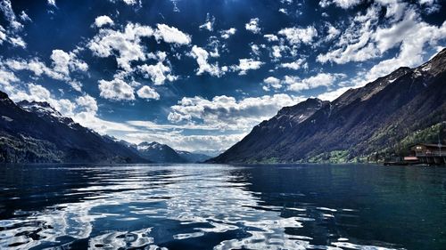 Scenic view of calm lake against mountain range