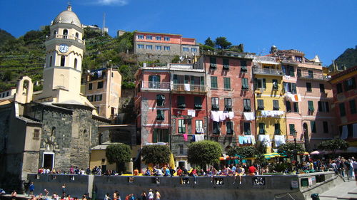 Group of people in front of buildings in city