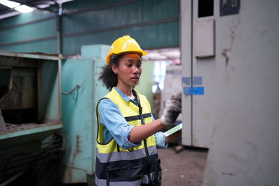 Portrait of engineer working at construction site