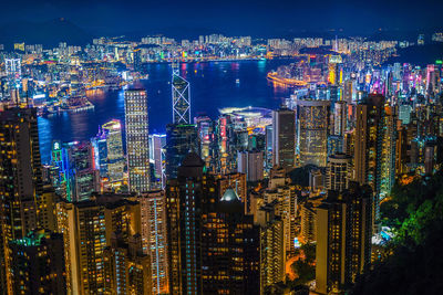 High angle view of city lit up at night