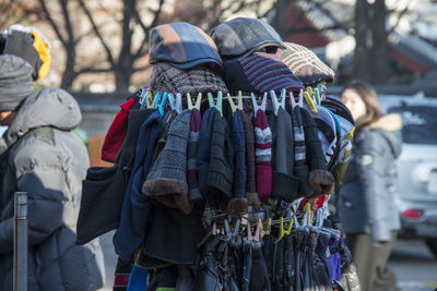 Close-up of knit hats for sale on street