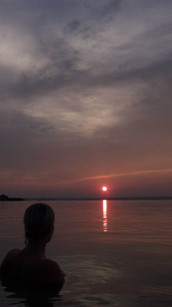 Hungary Summersunset Summersky Summer Summer ☀ Sister Balaton Lake Balaton - Hungary Balatonmáriafürdő Balaton Water Sky Sea Sunset Beauty In Nature Tranquility Nature Cloud Scenics - Nature Reflection One Person Horizon Over Water Tranquil Scene Rear View Ocean Horizon Dawn Beach Relaxation Silhouette