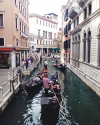 People on boats in canal