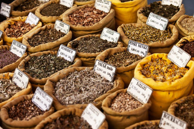 High angle view of various spices displayed for sale at market stall