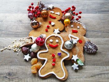 High angle view of christmas cookies and decorations on table