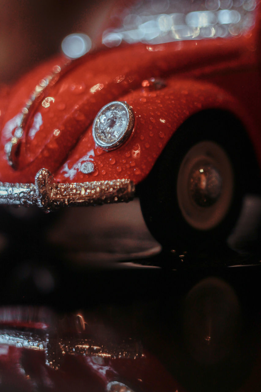 CLOSE-UP OF RAINDROPS ON CAR