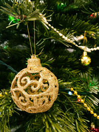 Close-up of christmas decoration hanging on tree