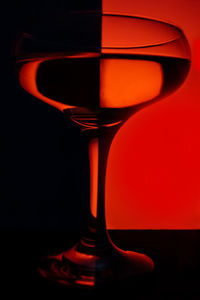 Close-up of beer glass against black background