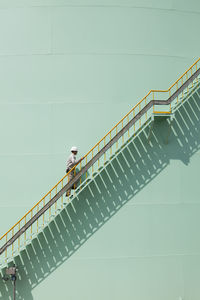 Low angle view of man climbing on steps