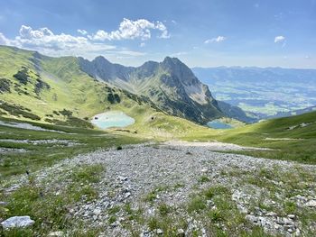 Scenic view of landscape and mountains against sky