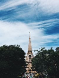 View of temple building against cloudy sky