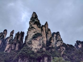 Low angle view of rocks against sky