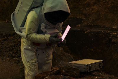 A scientist with protective working suit