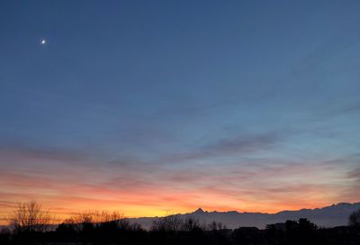 Scenic view of silhouette landscape against sky during sunset
