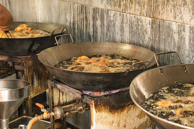 High angle view of meat on barbecue grill at kitchen