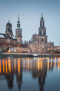 Reflection of illuminated buildings in city