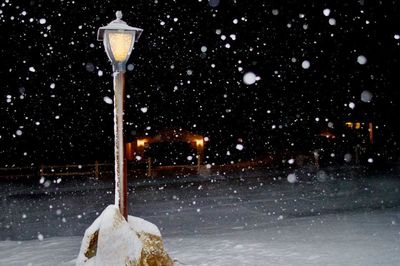 Snow covered street at night