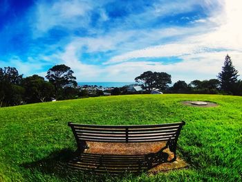 Green landscape against sky