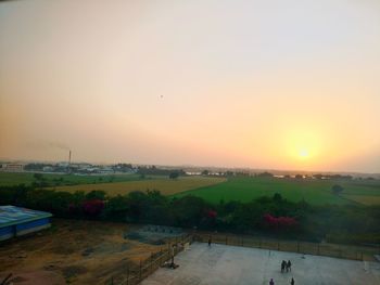 Scenic view of landscape against sky during sunset