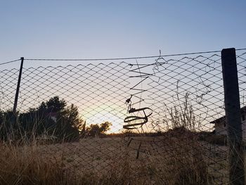 Scenic view of field against sky during sunset