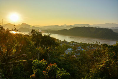 Sun above mountains before sunset