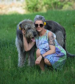 Woman with dog on field