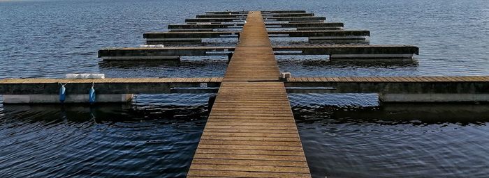 Wooden jetty on pier over sea