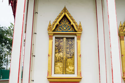 Low angle view of ornate window on building