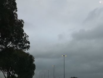 Low angle view of street light against sky