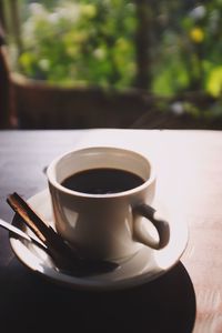 Close-up of coffee cup on table