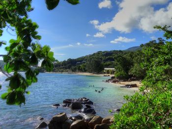 Scenic view of sea against cloudy sky