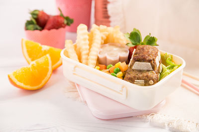 Close-up of fruits in plate on table