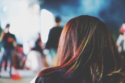 Rear view of woman against blurred background