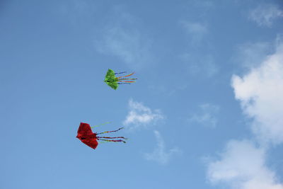 Low angle view of helicopter against sky