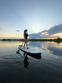 Rear view of man jumping in sea