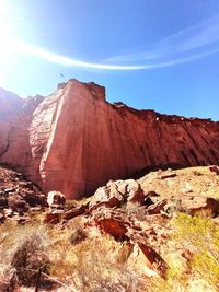 Rock formations on landscape against sky