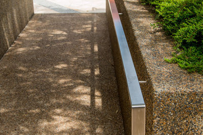 High angle view of footpath by road