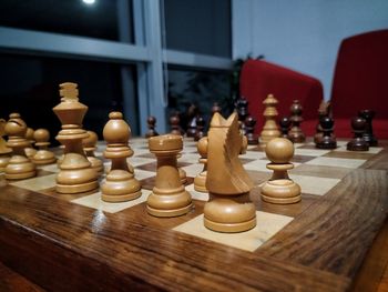 Close-up of chess pieces on table