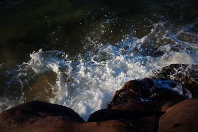 Waves splashing on rocks