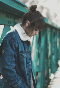 Portrait of girl standing on bridge