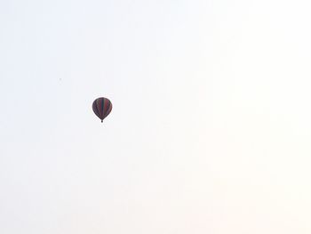 Low angle view of hot air balloon against clear sky