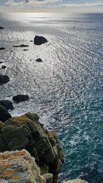 High angle view of rocks on sea