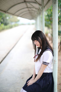 Side view of woman standing outdoors