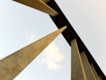 Low angle view of metal structure against sky