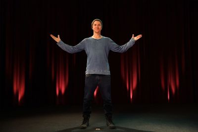 Low angle view of mature man standing on stage