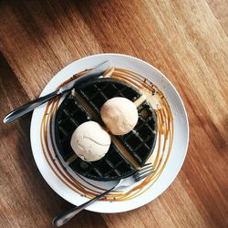 Directly above shot of ice cream in plate on table