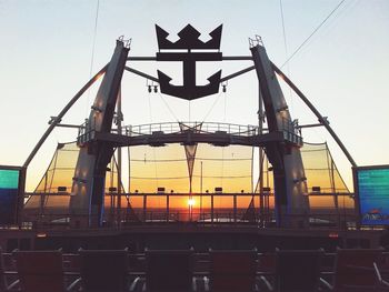 Low angle view of bridge against sky during sunset