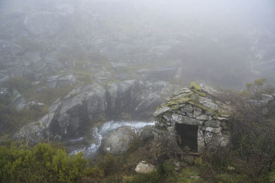 Scenic view of foggy weather on mountain