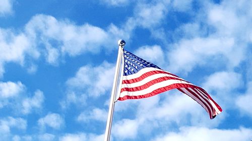 Low angle view of flag against sky