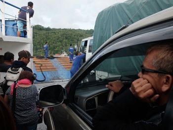 People in car against sky